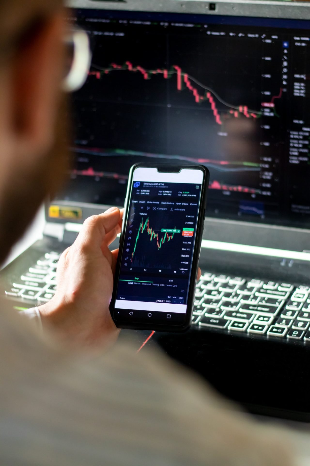 Cryptocurrency trader monitoring stock market